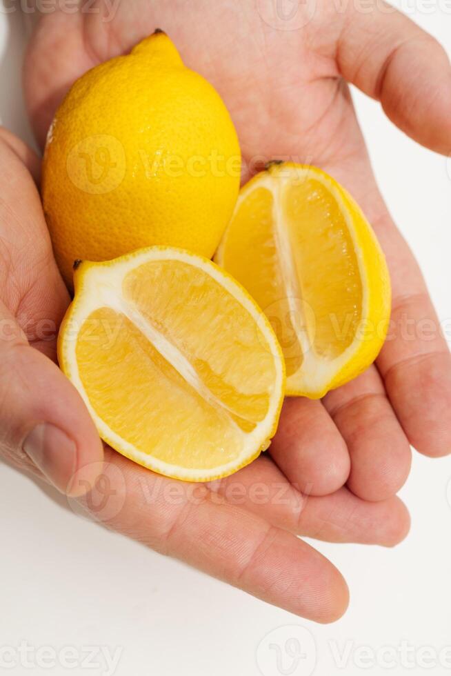 lemon in hands photo