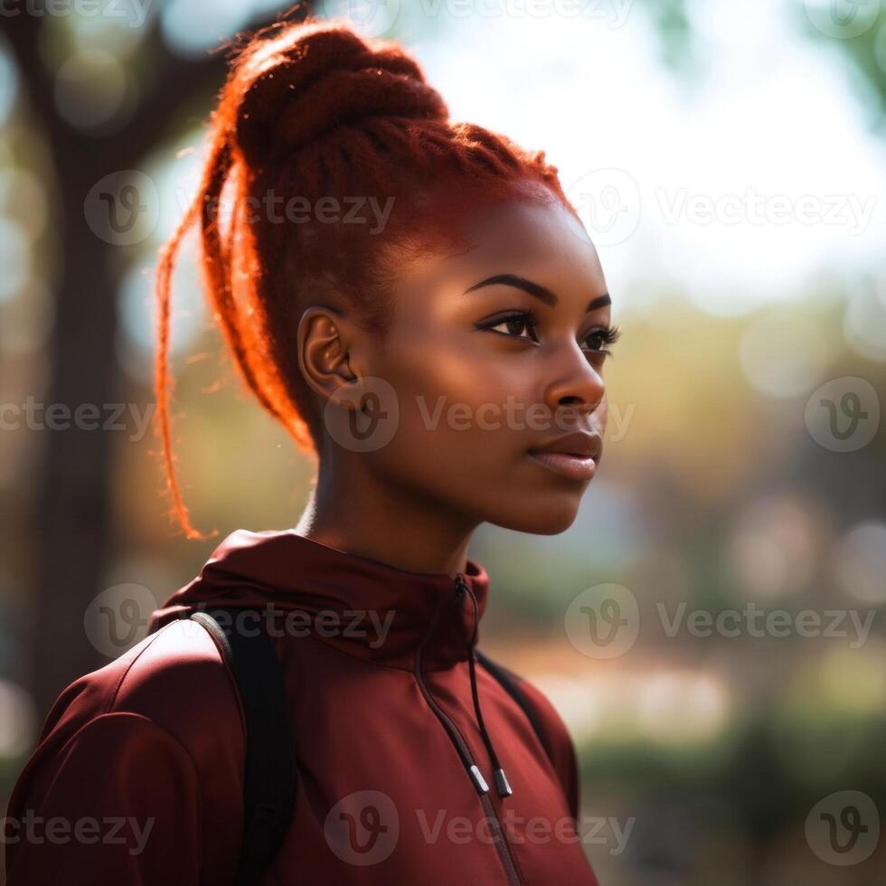 A woman with red hair and a red hoodie photo