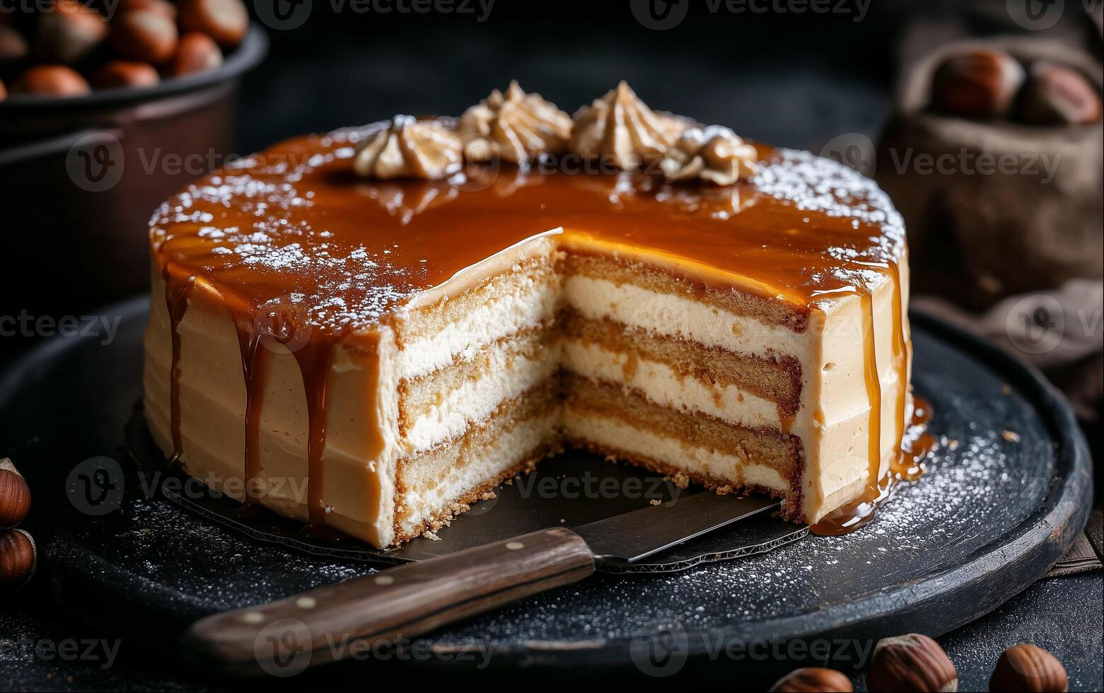 Decadent caramel cake on a dark plate photo