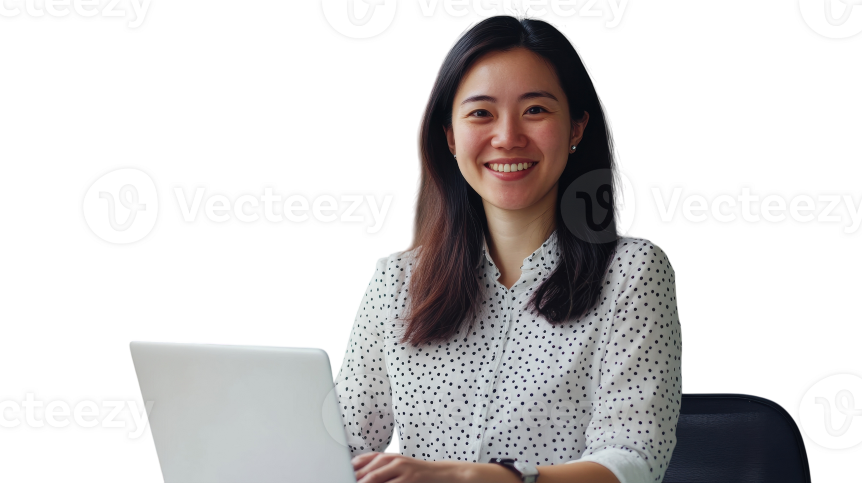 Smiling woman working on laptop in office setting, dressed in polka dot shirt during daytime png