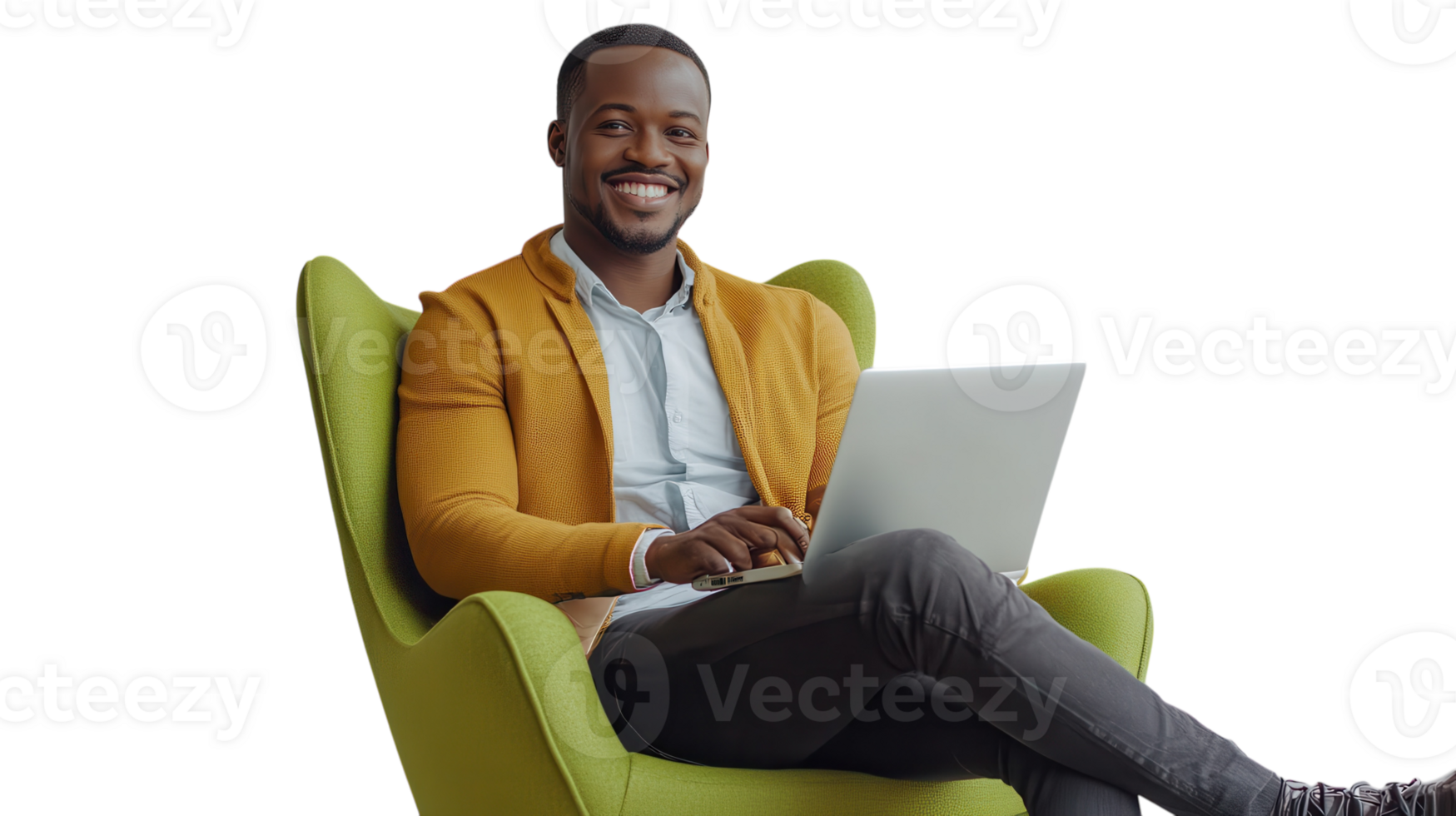 Smiling man sitting comfortably in a green armchair while using a laptop indoors png