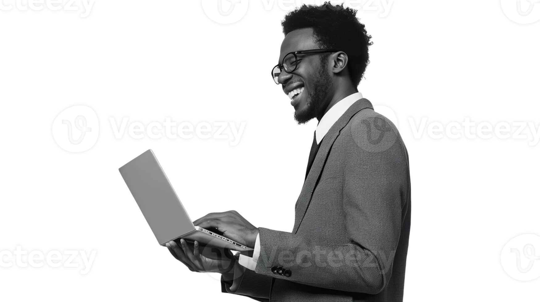 Joyful businessman working on laptop while standing in a casual office environment during daytime png