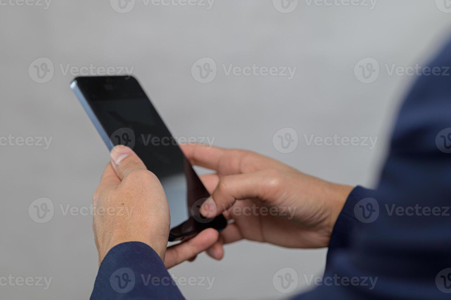 Close-up of Hands Using Smartphone in Professional Setting photo