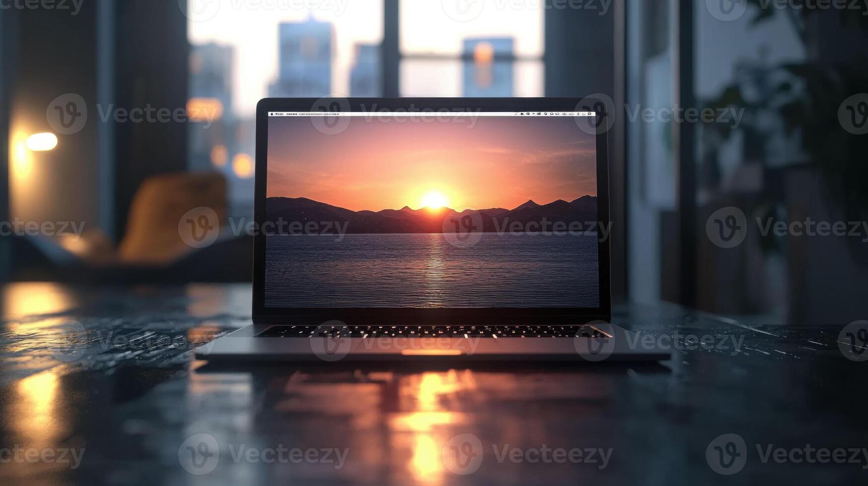 laptop displaying sunset over water, creating serene atmosphere photo
