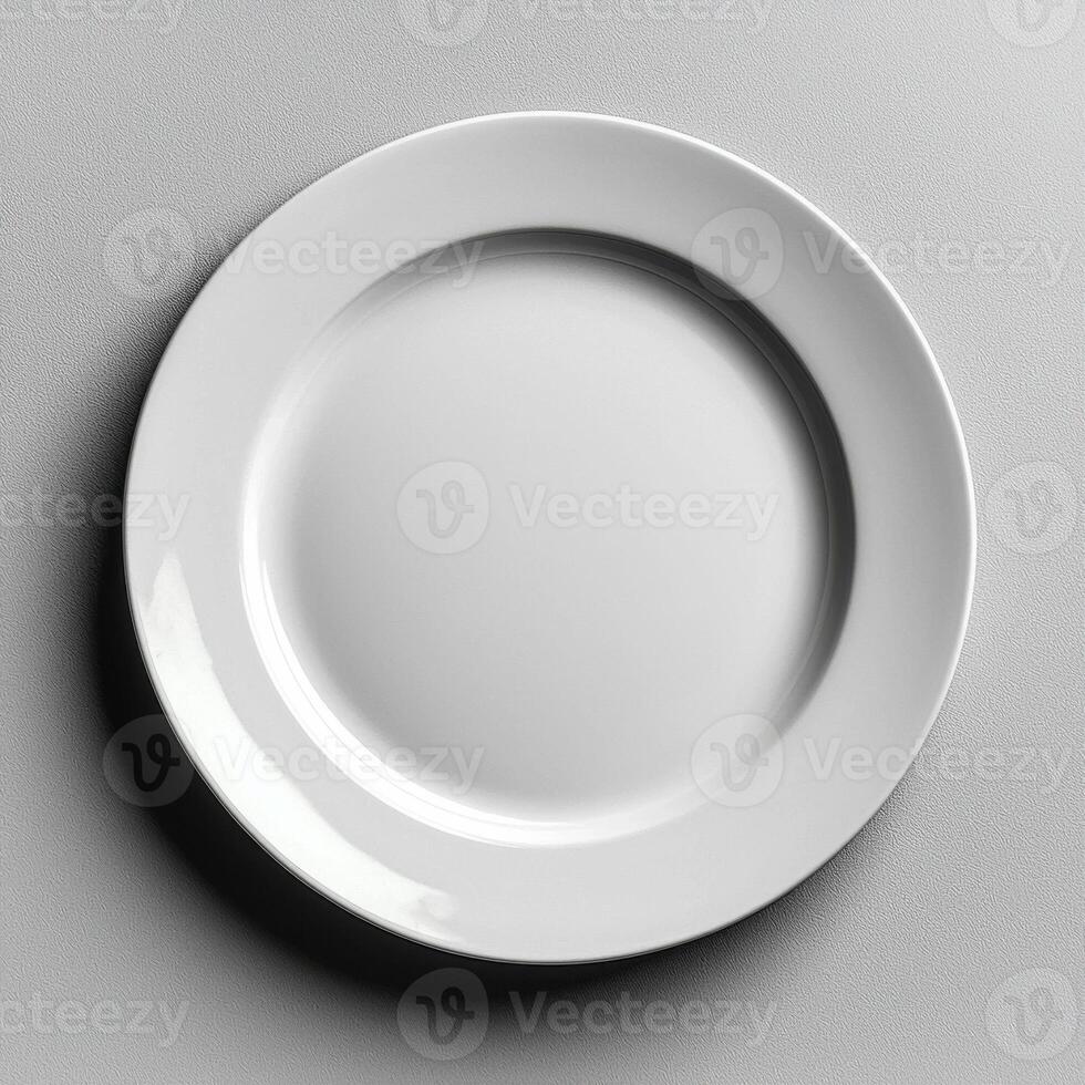 Minimalist white ceramic plate with smooth surface and blank center photo