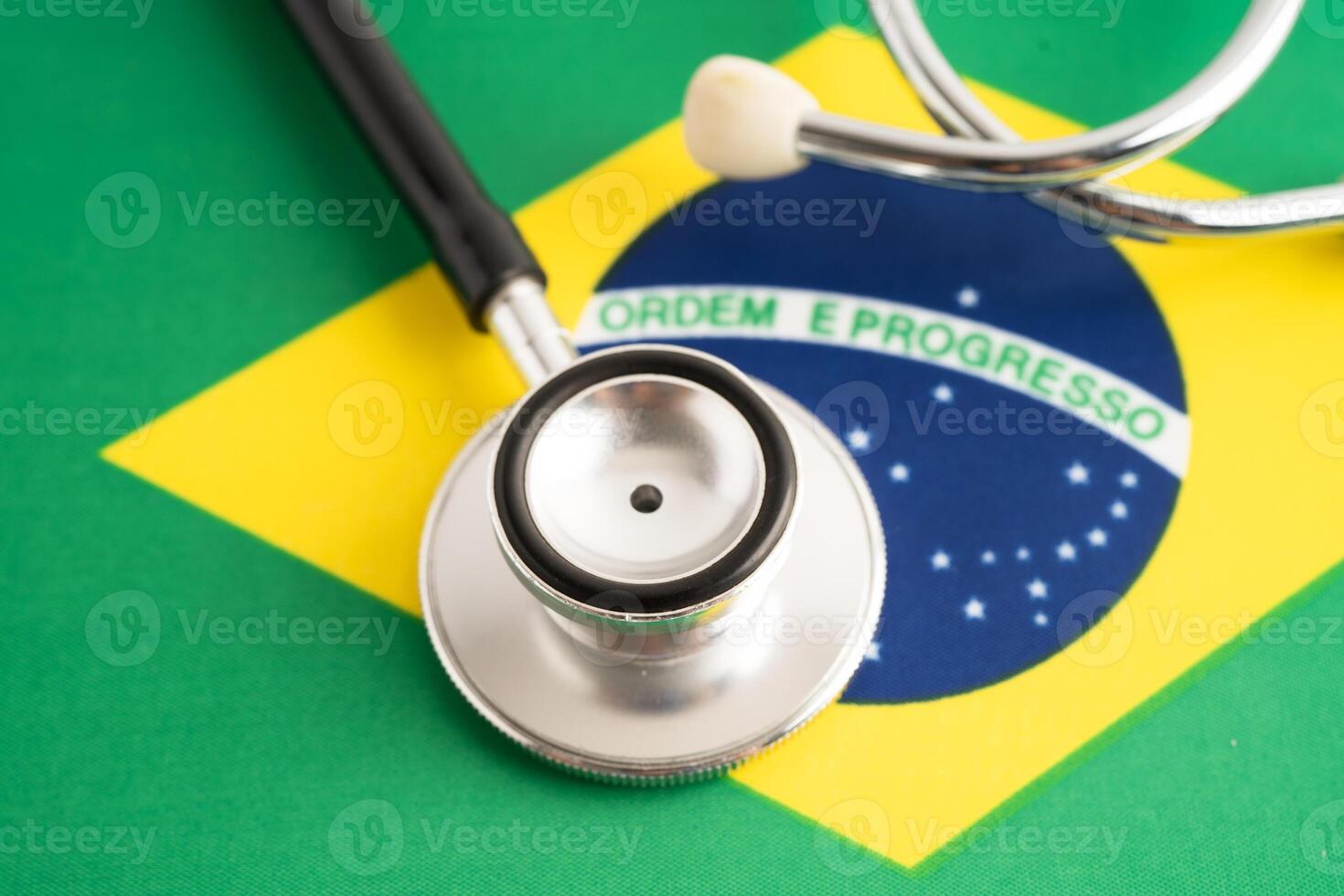 Stethoscope on Brazil flag, business and finance. photo