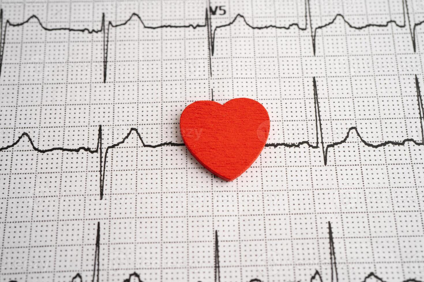 Red heart on electrocardiogram ECG with red heart, heart wave, photo