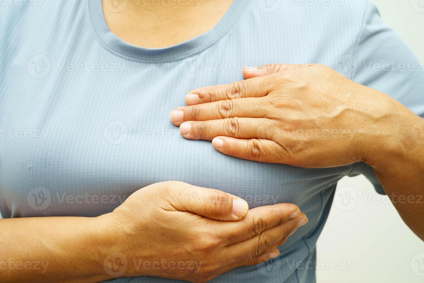 Asian woman self touching check lump or Breast cancer, Breast Self Exam. photo