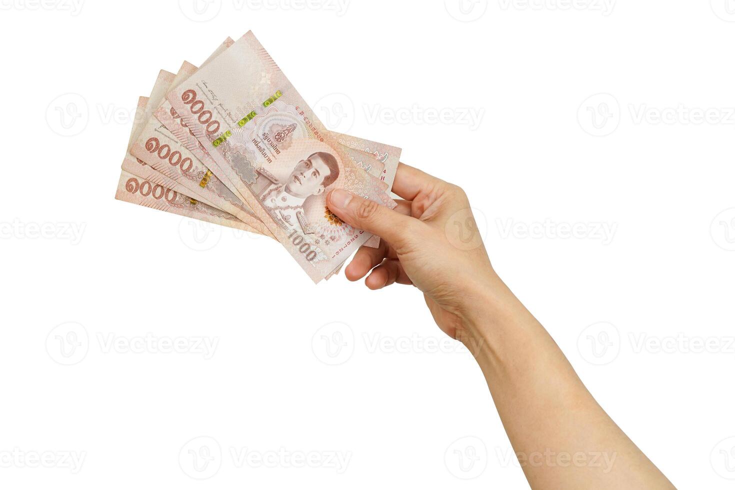 Asian woman holding Thai baht banknote money in hand isolated on white photo