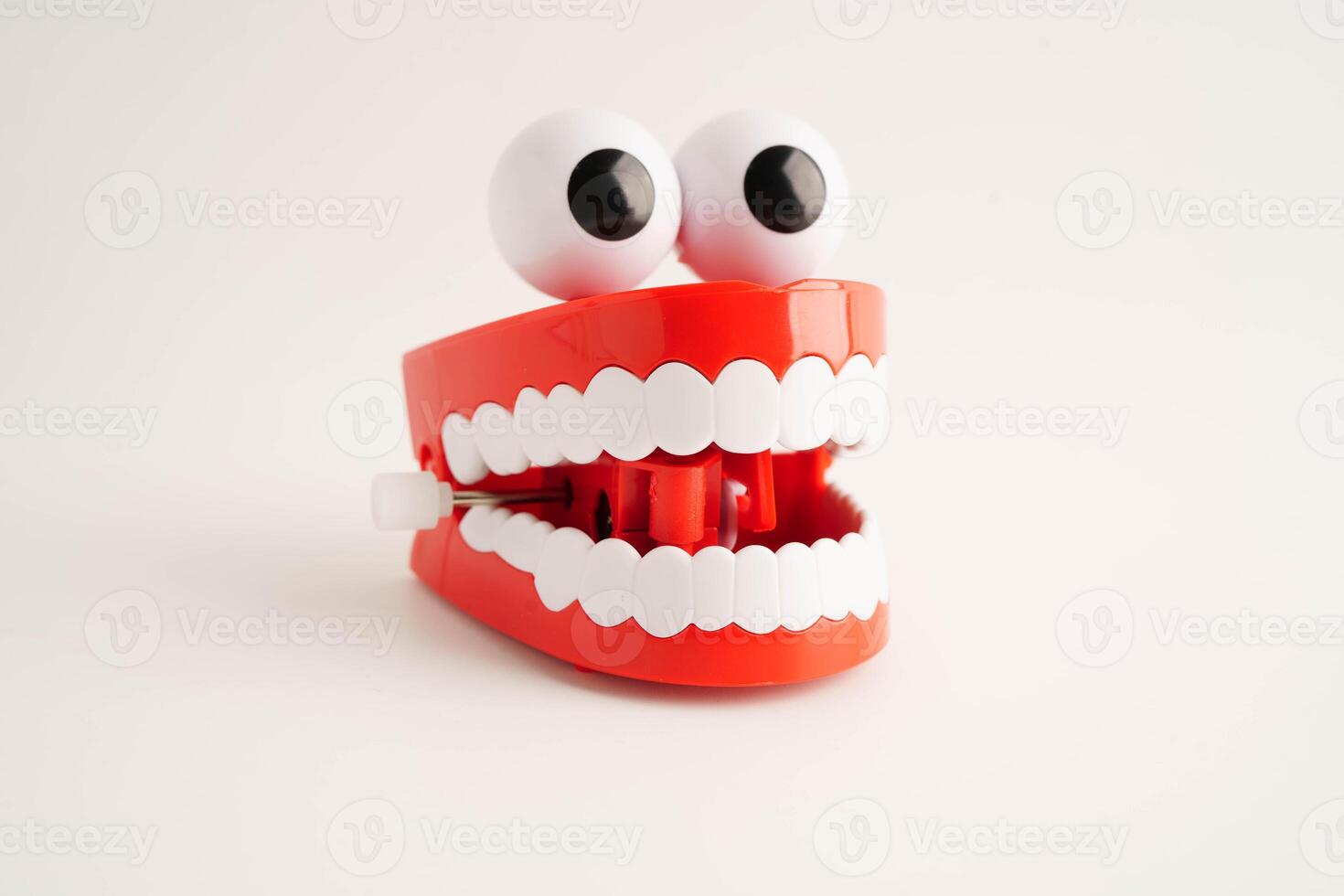 Funny red teeth with eye toy denture model for dental photo