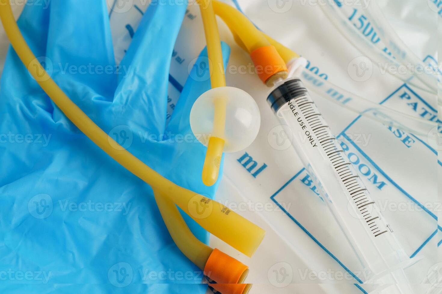 Foley catheter and urine drainage bag collect urine for disability or patient photo