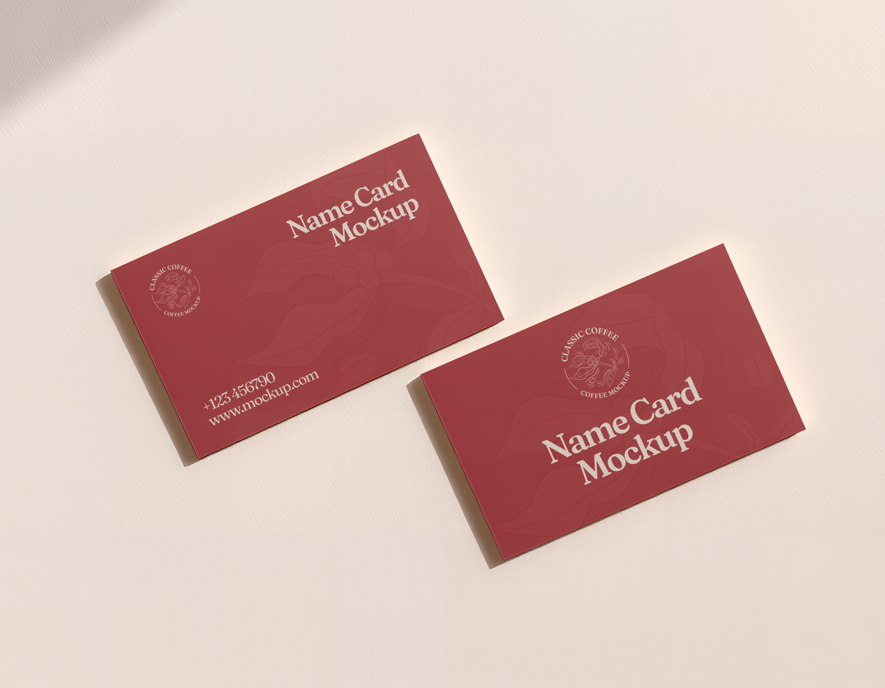 Two business cards mockup on a white surface psd