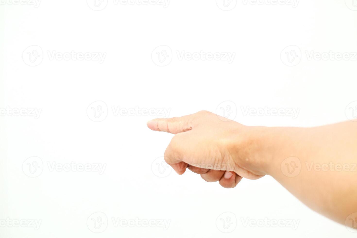 A human hand points toward the left side against plain white background direction for concepts photo