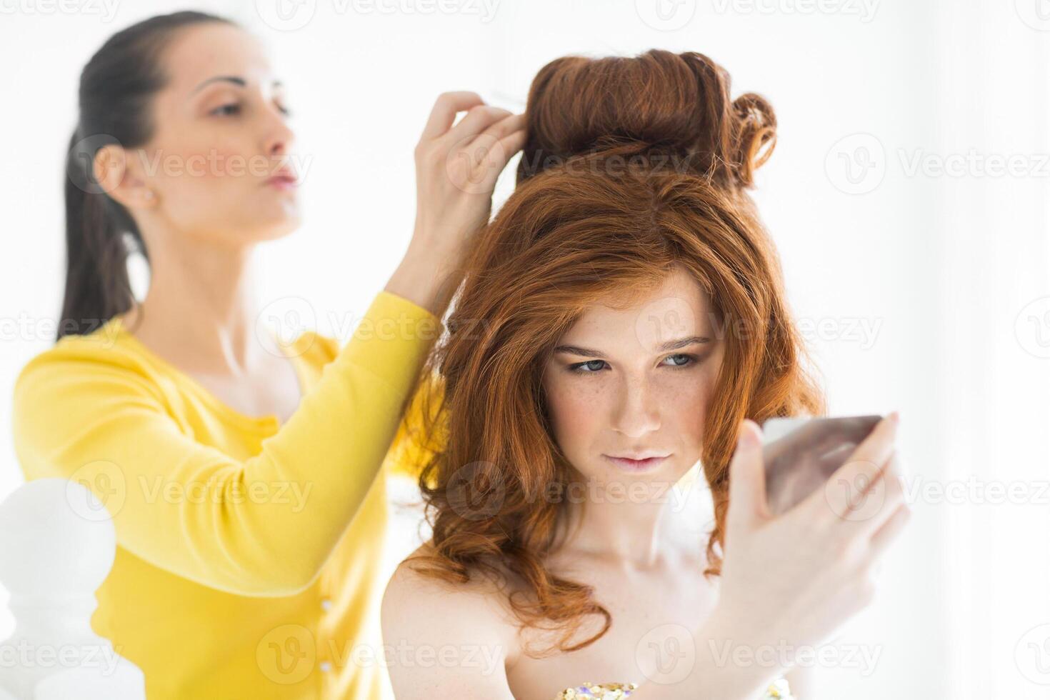 Hair stylist makes the red haired bride photo