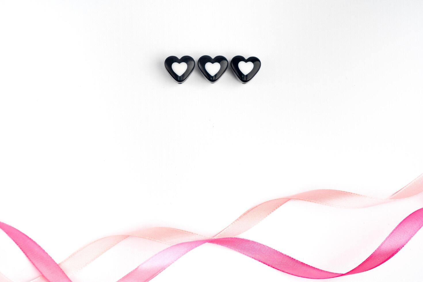 valentine love romance white background with pink ribbon and three heart sign symbol copy space photo