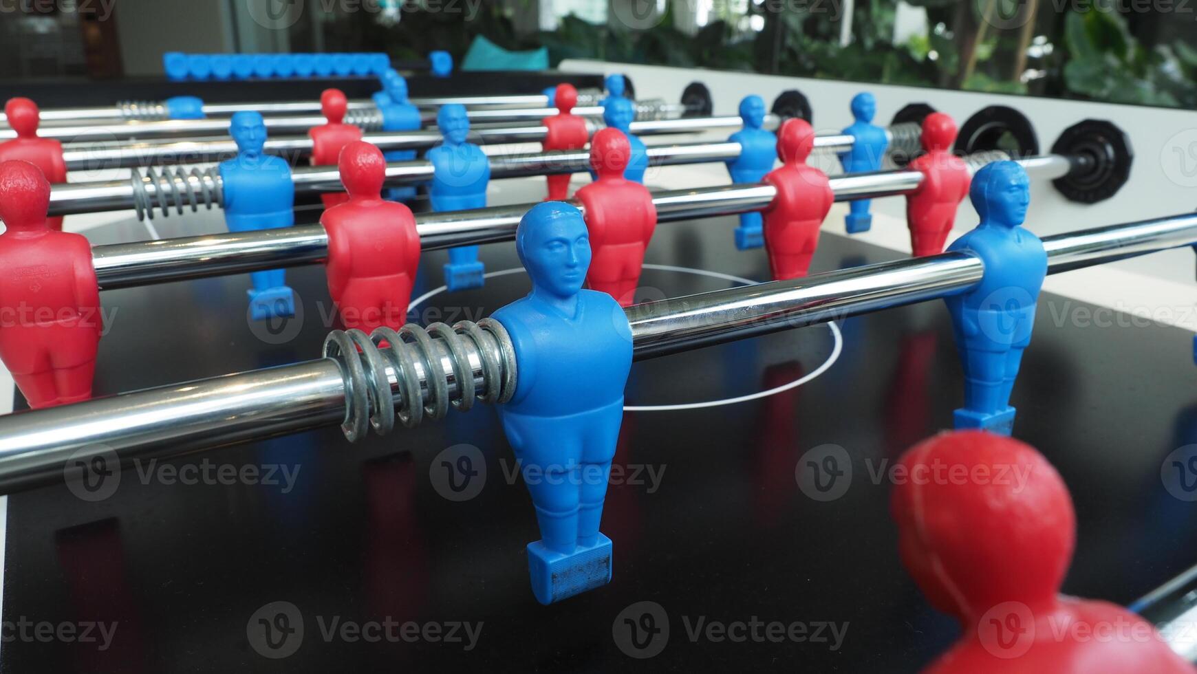Football table or soccer table game with plastic player figurine. Mini Soccer game which famous in past and be collectable item for foosball lover. Play by two hand control each row player figurine. photo