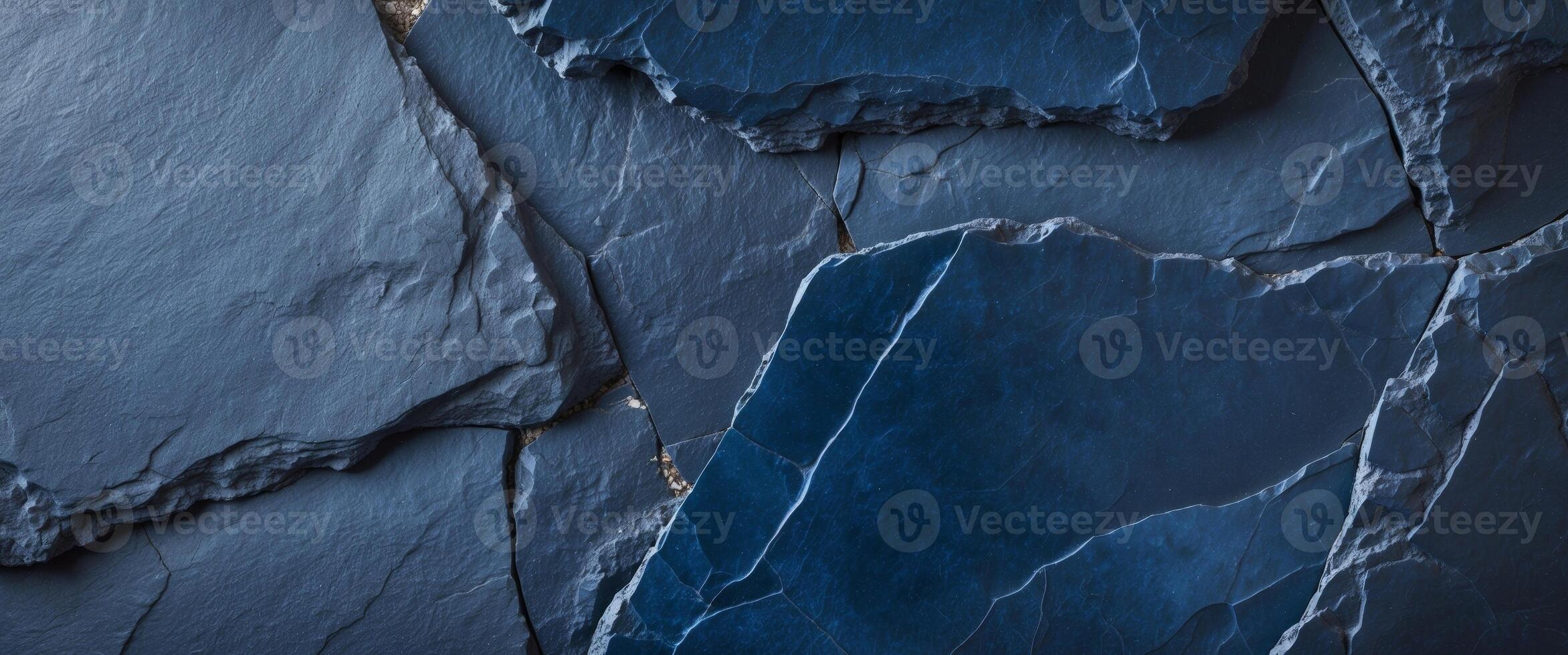 Rough surface of natural dark blue slate stone creating an abstract background with copy space. photo