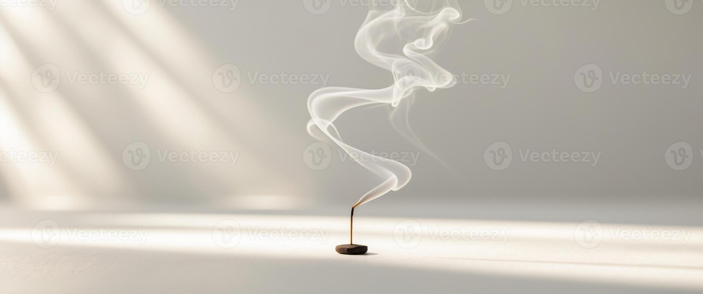 Soft Wisps of Incense Rising in Gentle Motion. photo