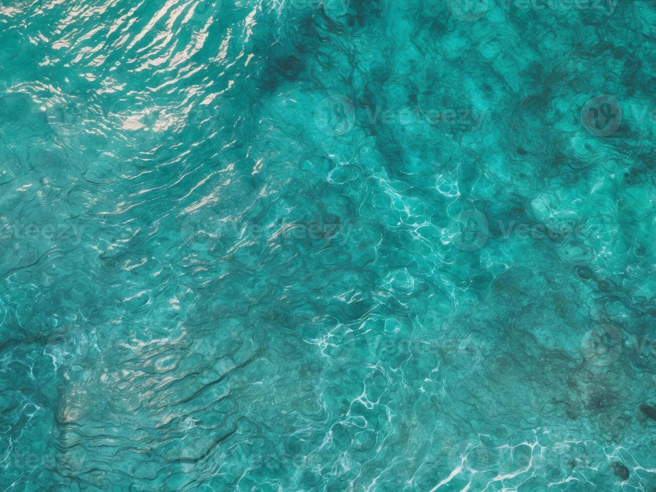 Aerial view of a turquoise water surface texture in a flat lay shot from a top down perspective in a close up photo