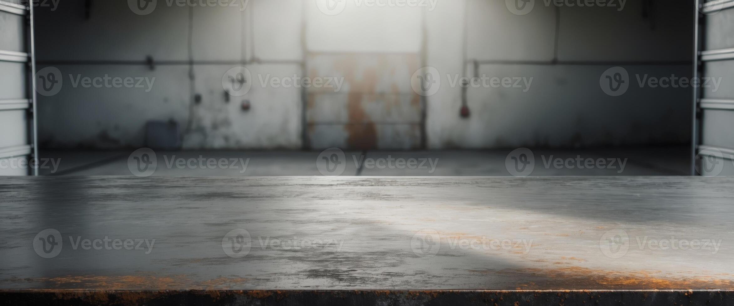 Blank rough metal workshop and desk table surface on blurred garage background with copy space photo