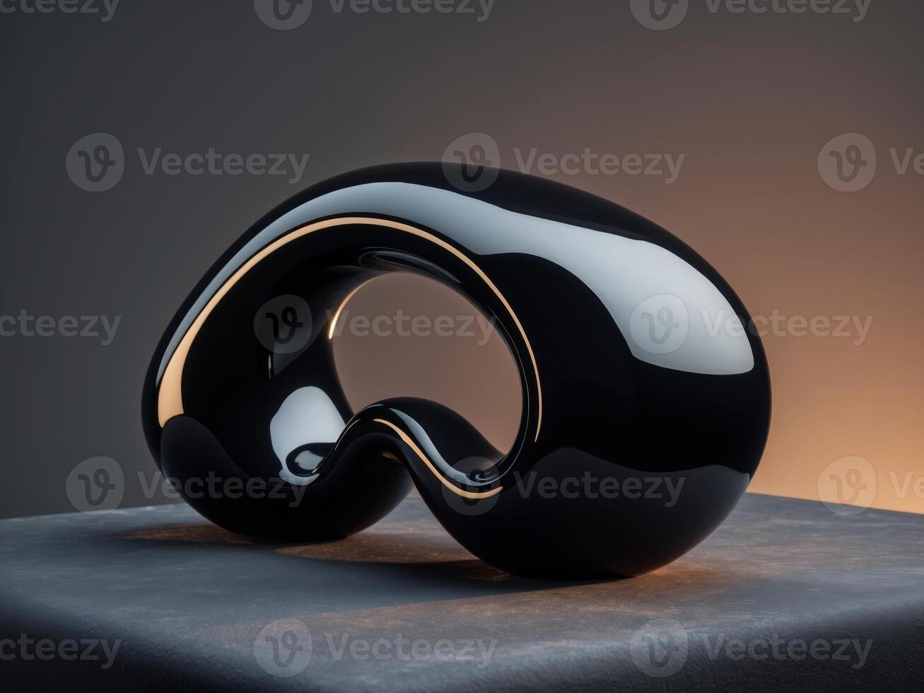 A sleek black object on a gray surface with soft lighting creates an elegant design. photo
