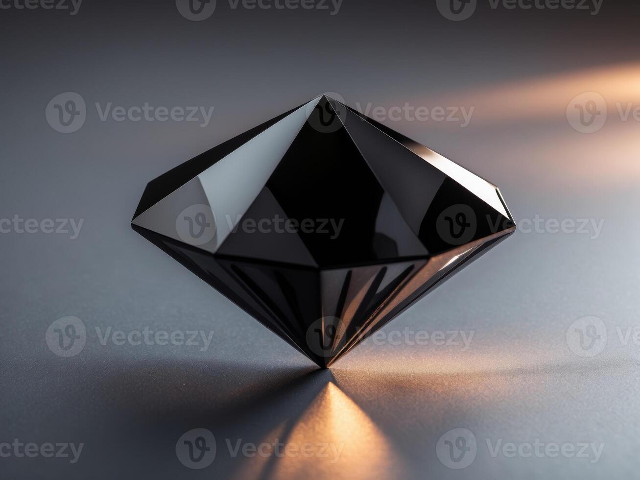A Black Diamond Shaped Object Rests on a Surface. photo
