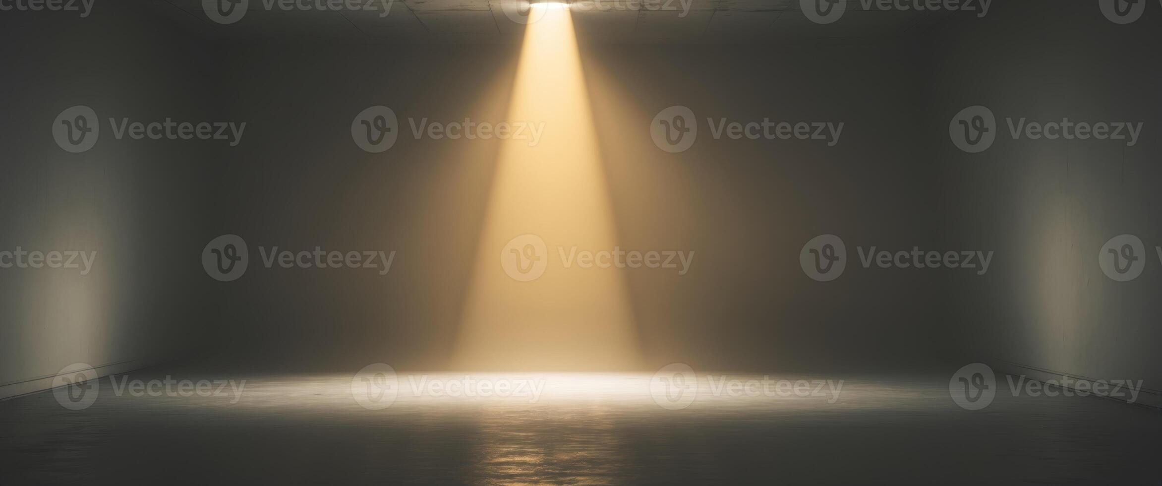 Bright beam of flashlight illuminating a dark room with golden light. photo
