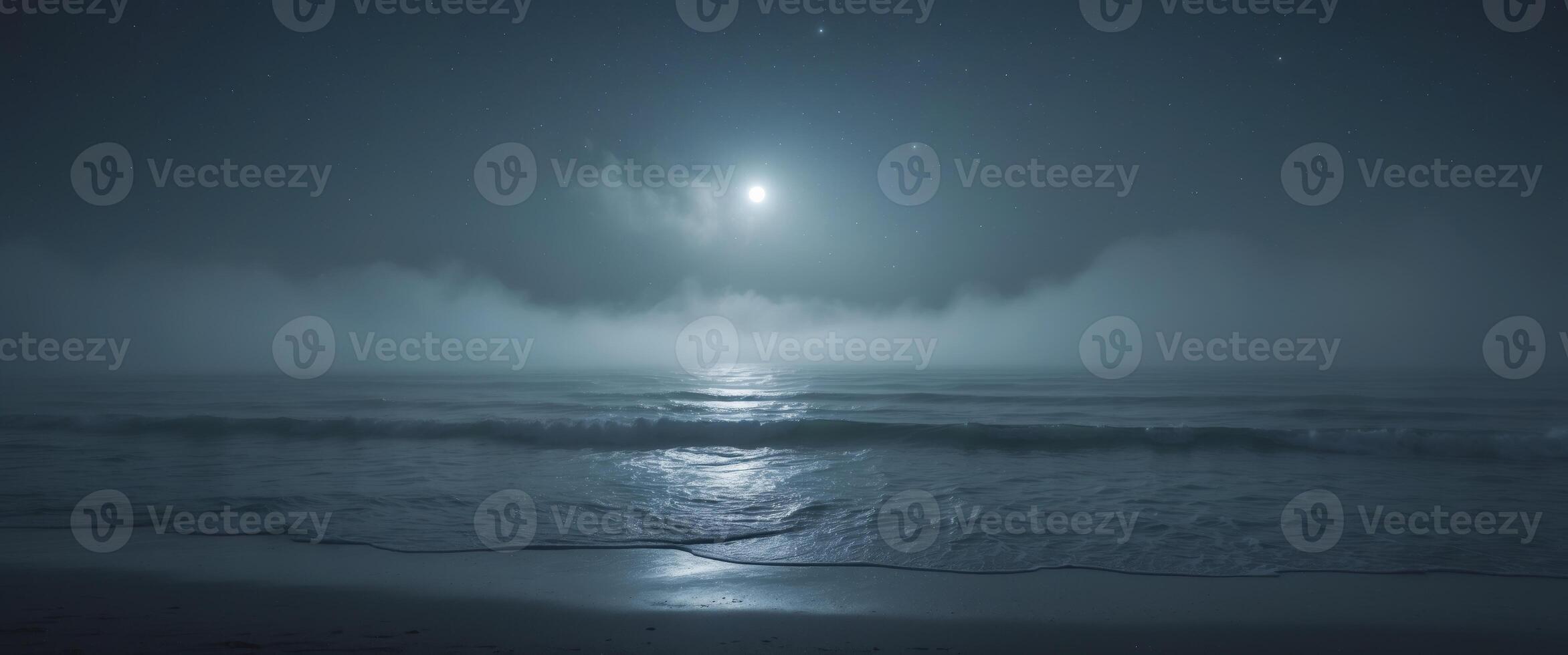 Mysterious fog rolls across a dark ocean surface during nighttime hours. photo