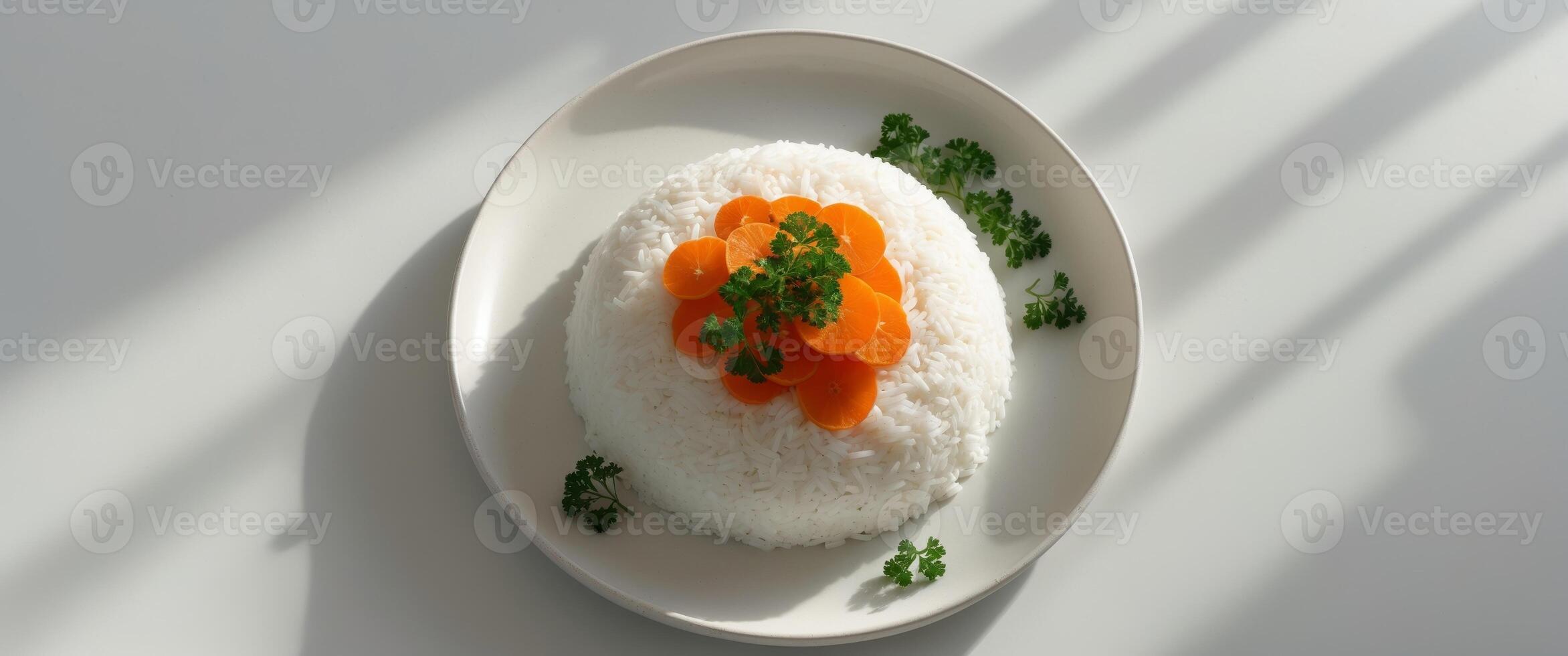 A plate of rice with carrots and parsley on top. photo