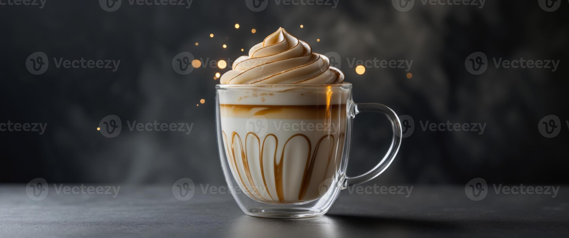 Elegant latte art in glass mug with creamy layers on dark background. photo