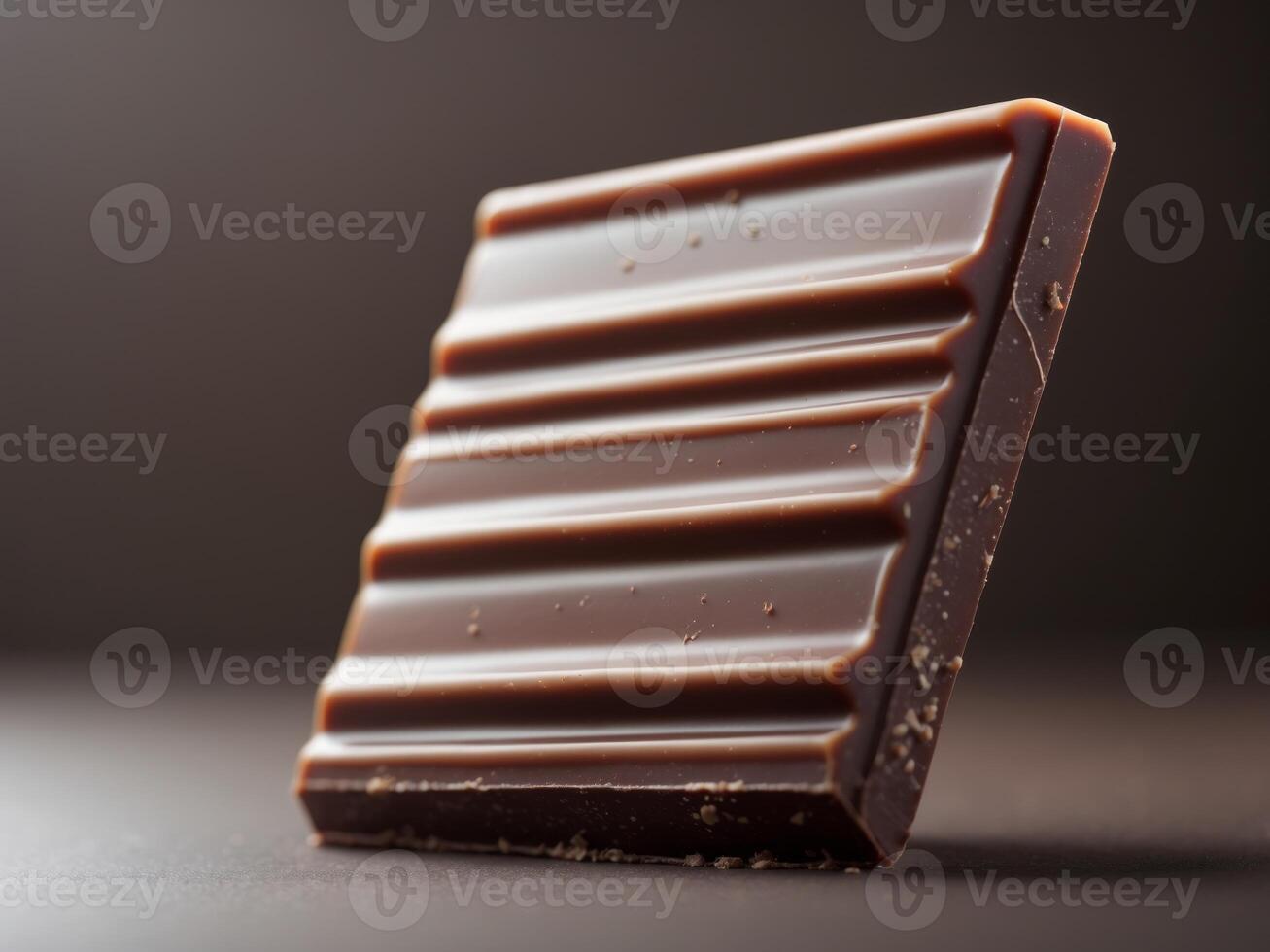 Close up View of Rich Milk Chocolate Bar With Smooth Texture and Shiny Surface photo