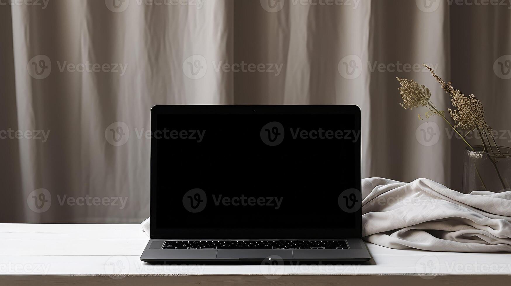 draped black laptop photo