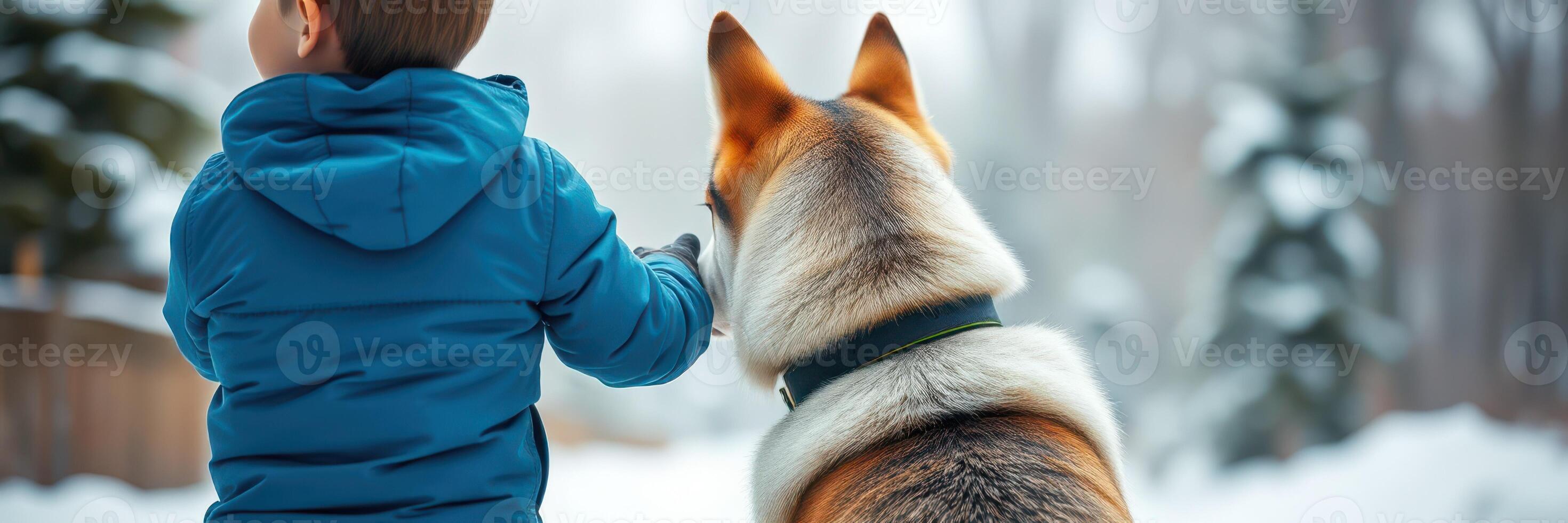 Child and dog enjoy a snowy walk in a serene winter landscape surrounded by trees photo