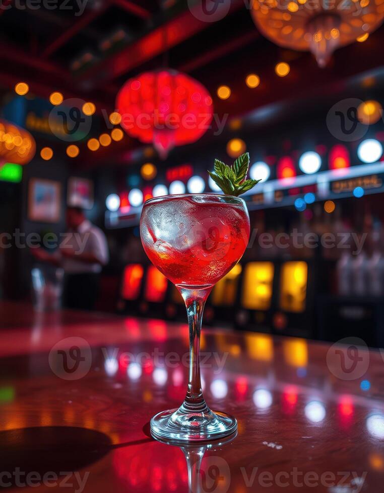 Vibrant cocktail served in an elegant glass with mint garnish at a lively bar with colorful lights photo