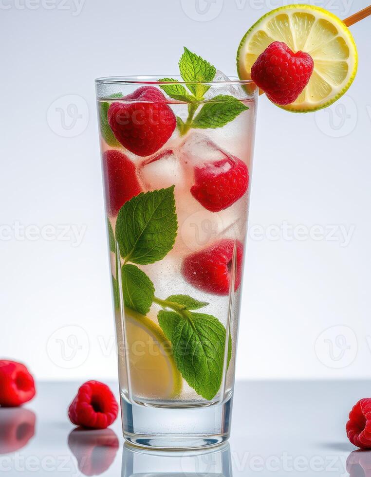 Refreshing raspberry lemonade with mint served in a tall glass on a bright countertop photo