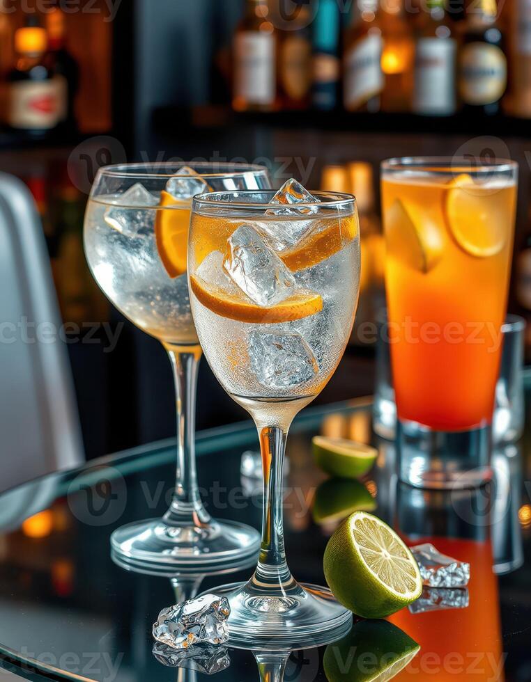 Refreshing cocktails served with citrus garnishes at a stylish bar during an evening gathering photo