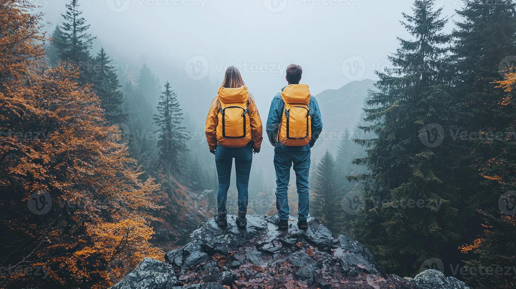 Two individuals stand apart on high cliff gazing each other amid vast chasm. Their expressions reveal mix of longing and uncertainty against breathtaking sunset backdrop photo