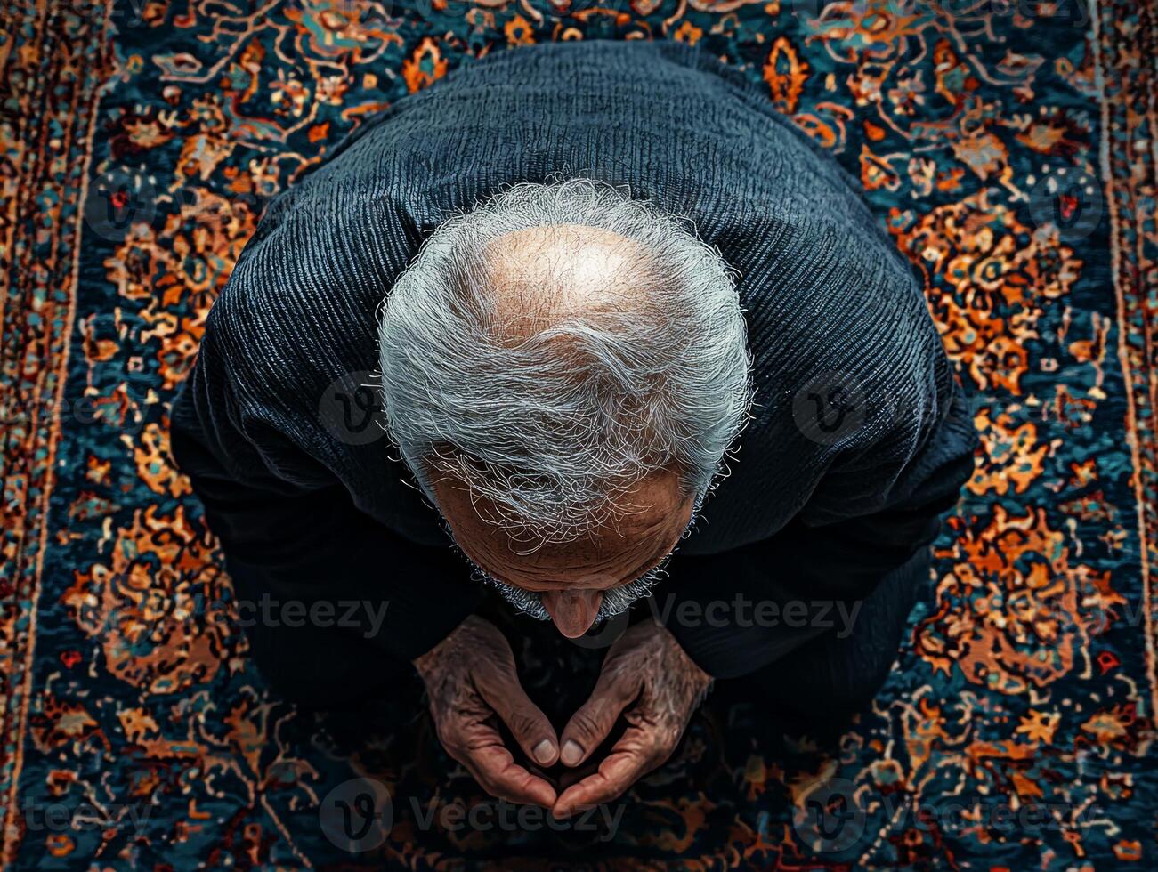 elderly Muslim man kneels in Sujood on richly patterned prayer rug his forehead touching ground as soft golden light filters through nearby windows photo