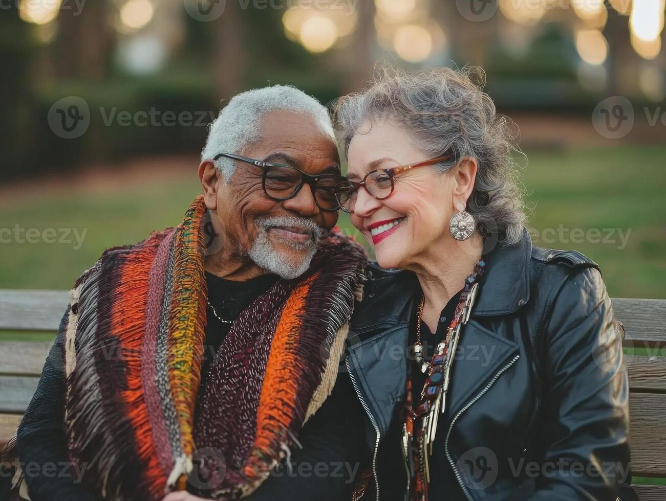 elderly gay couple sits closely on park bench holding hands and sharing warm smiles. golden hour light enhances their joyful expression highlighting their love and connection photo