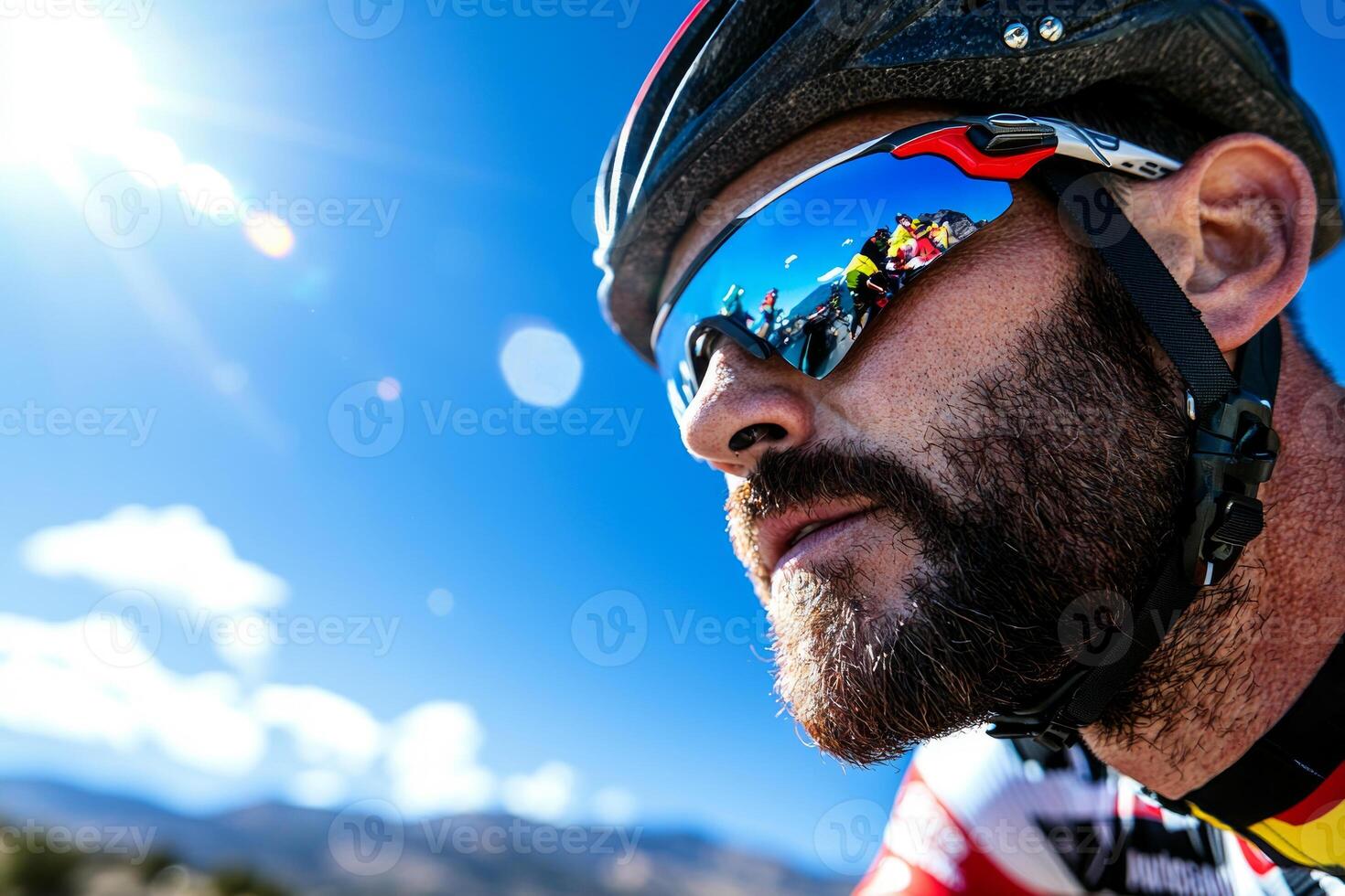 Asian cyclist prosthetic leg pedals powerfully on mountain road surrounded scenic peaks. Sunlight reflects off his helmet and sunglasses highlighting his determination photo