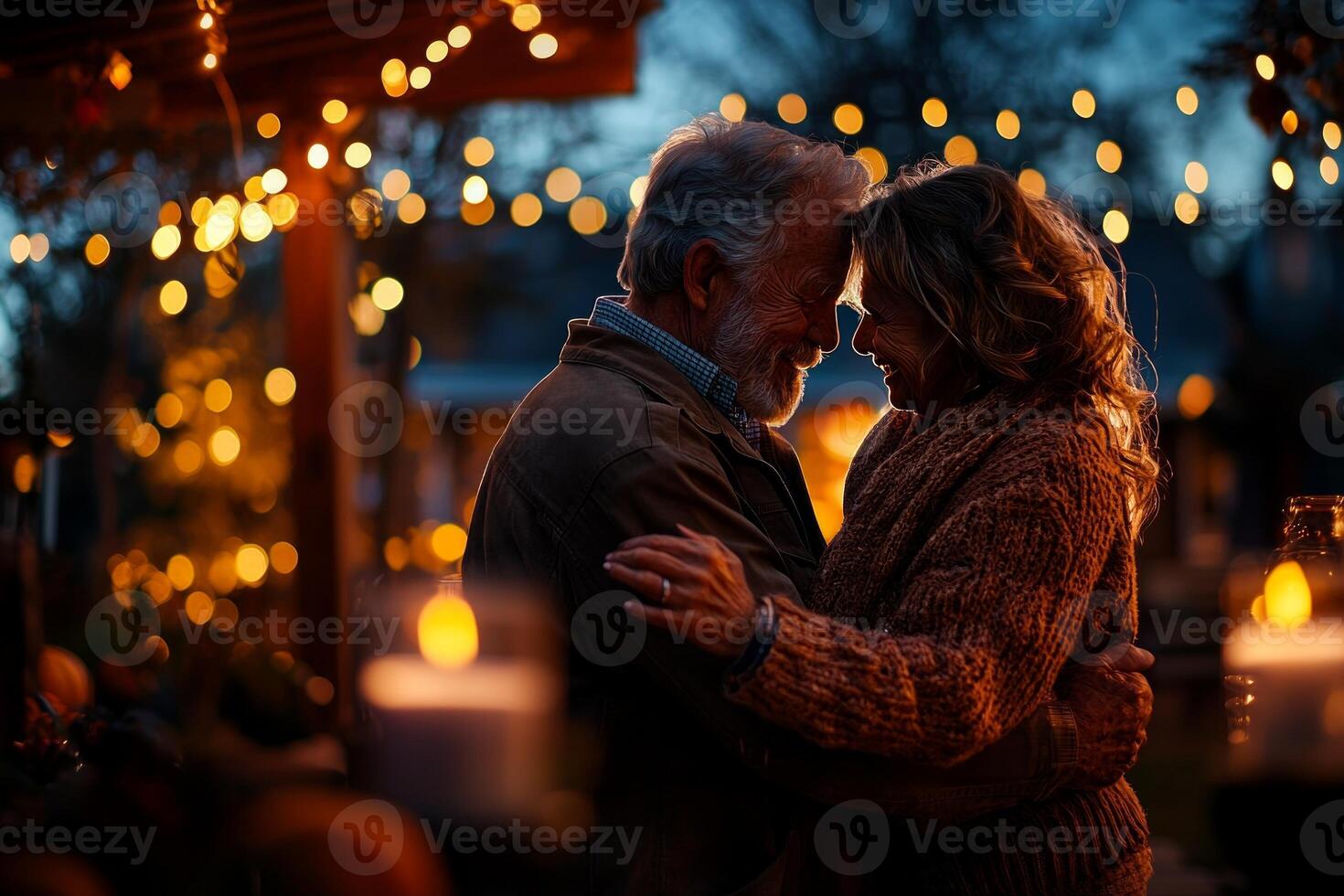 elderly couple dances in their backyard surrounded warm string lights as twilight sets in. soft motion creates dreamy atmosphere enhancing their joyful moment together photo