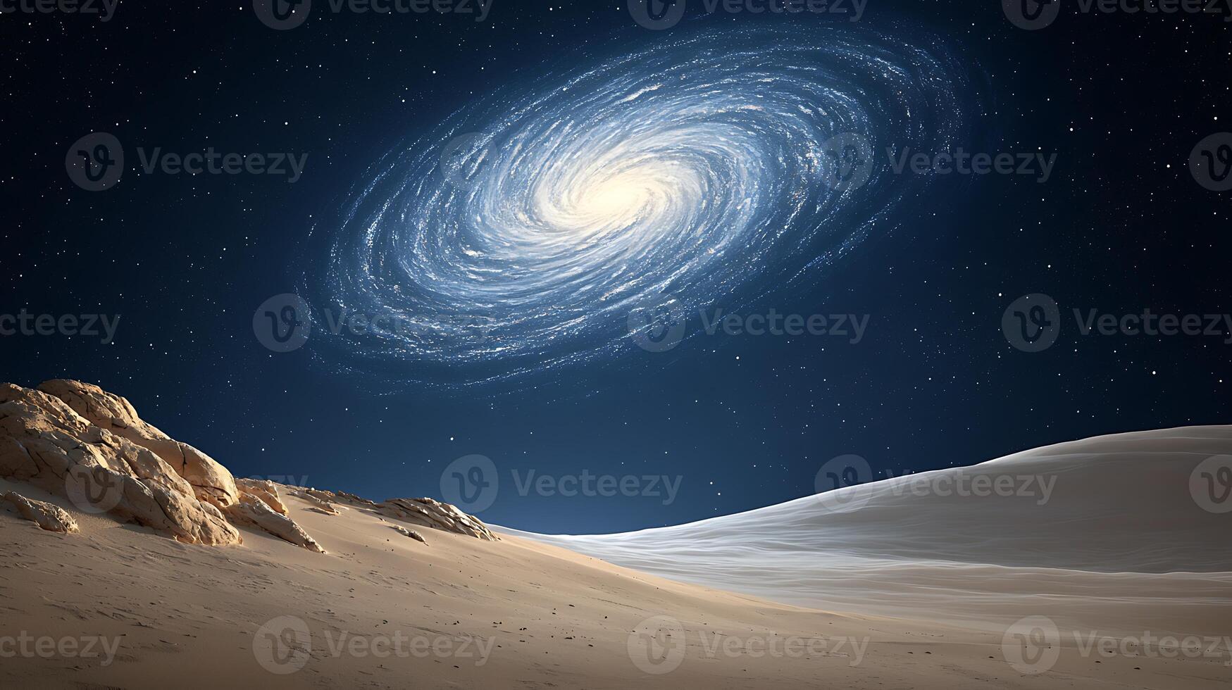 A breathtaking view of a spiral galaxy above a serene desert landscape at night photo