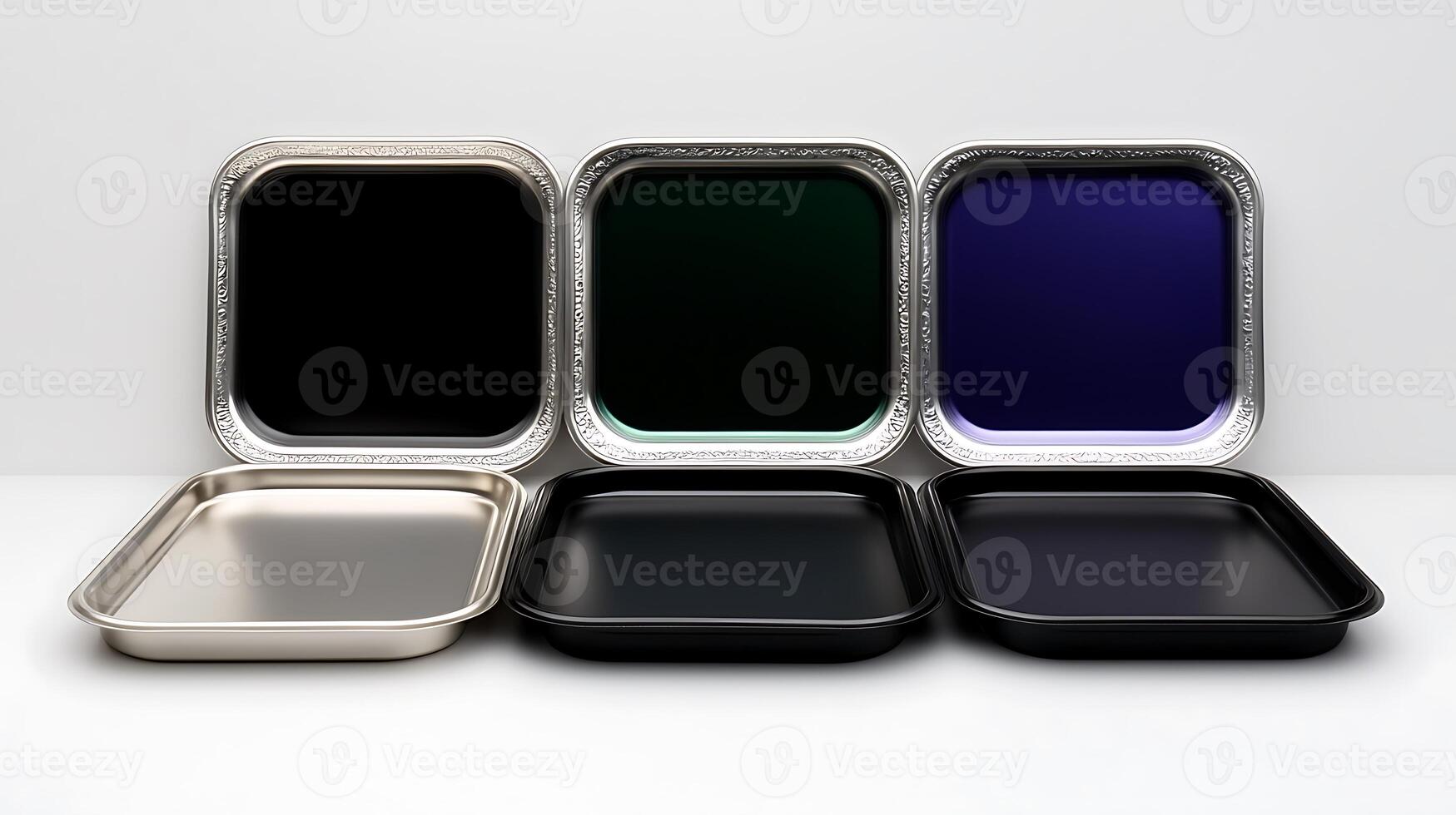 A collection of five stylish trays in various colors and finishes arranged neatly on a clean surface photo