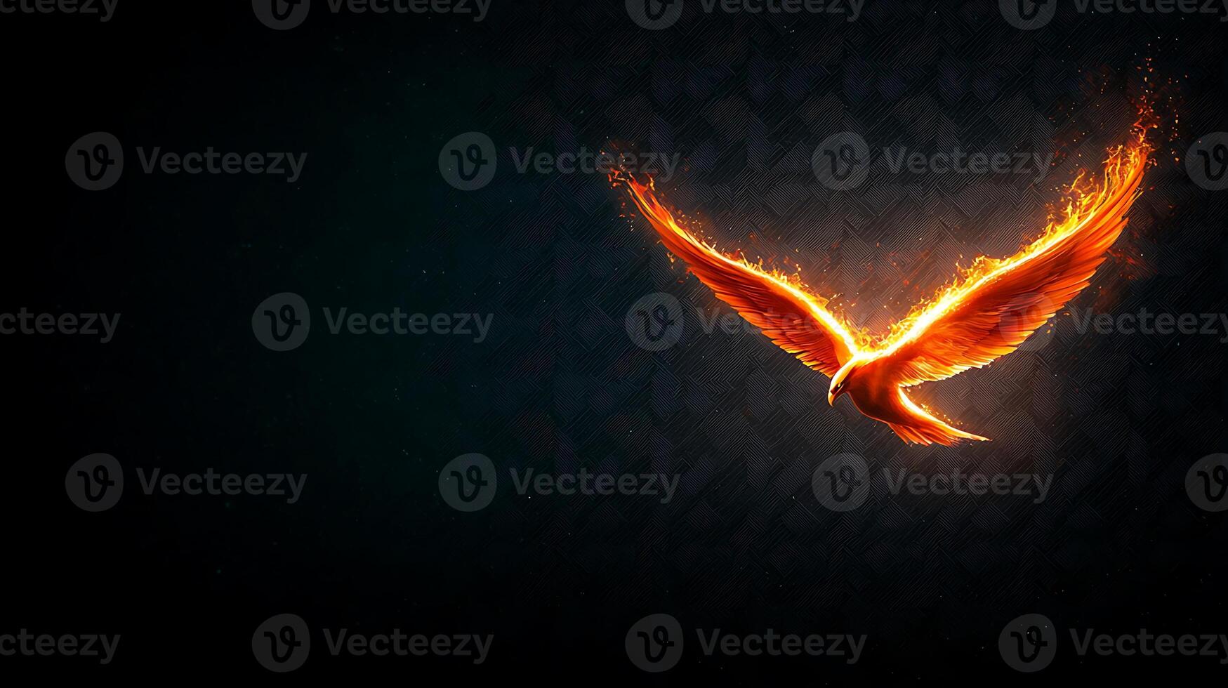 A bird flying in the air with flames coming out of its wings photo