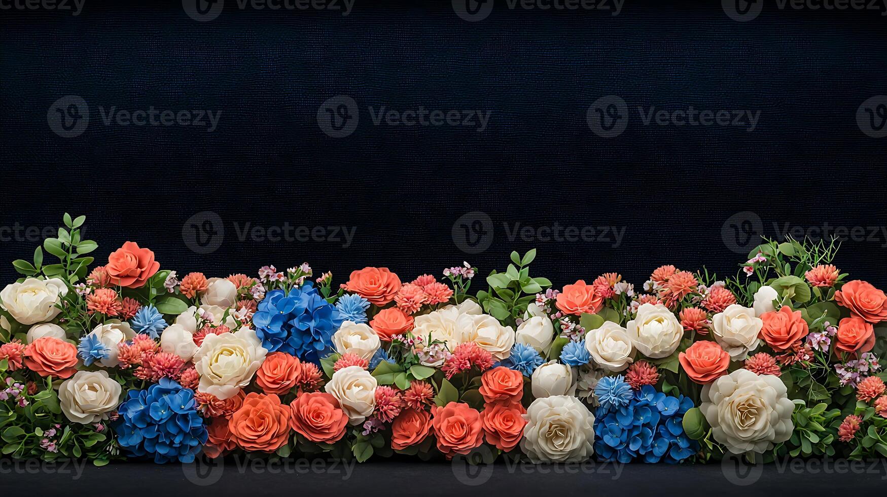 A row of red, white and blue flowers on a black background photo