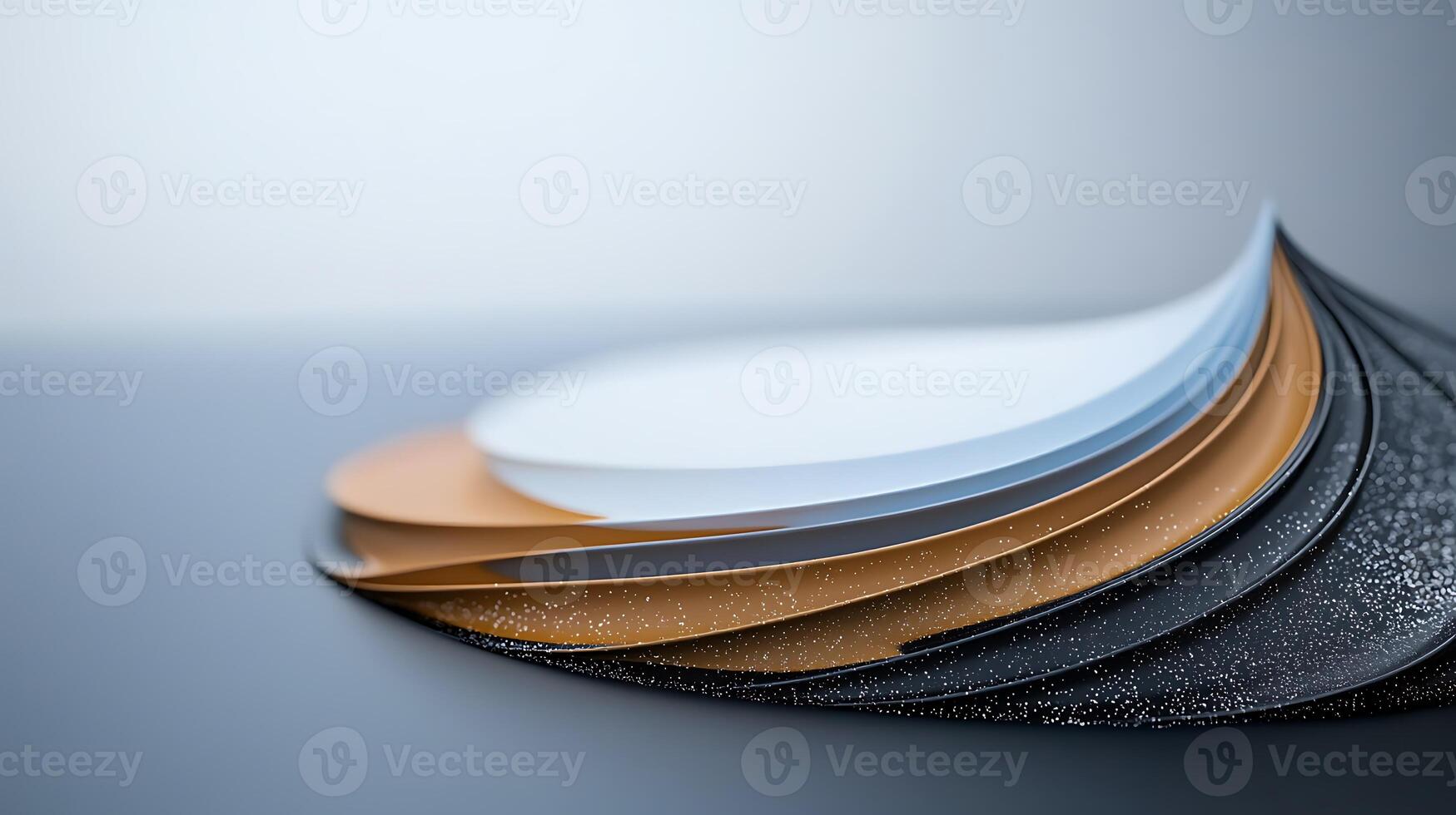 A stack of black and white paper with a white and black design photo