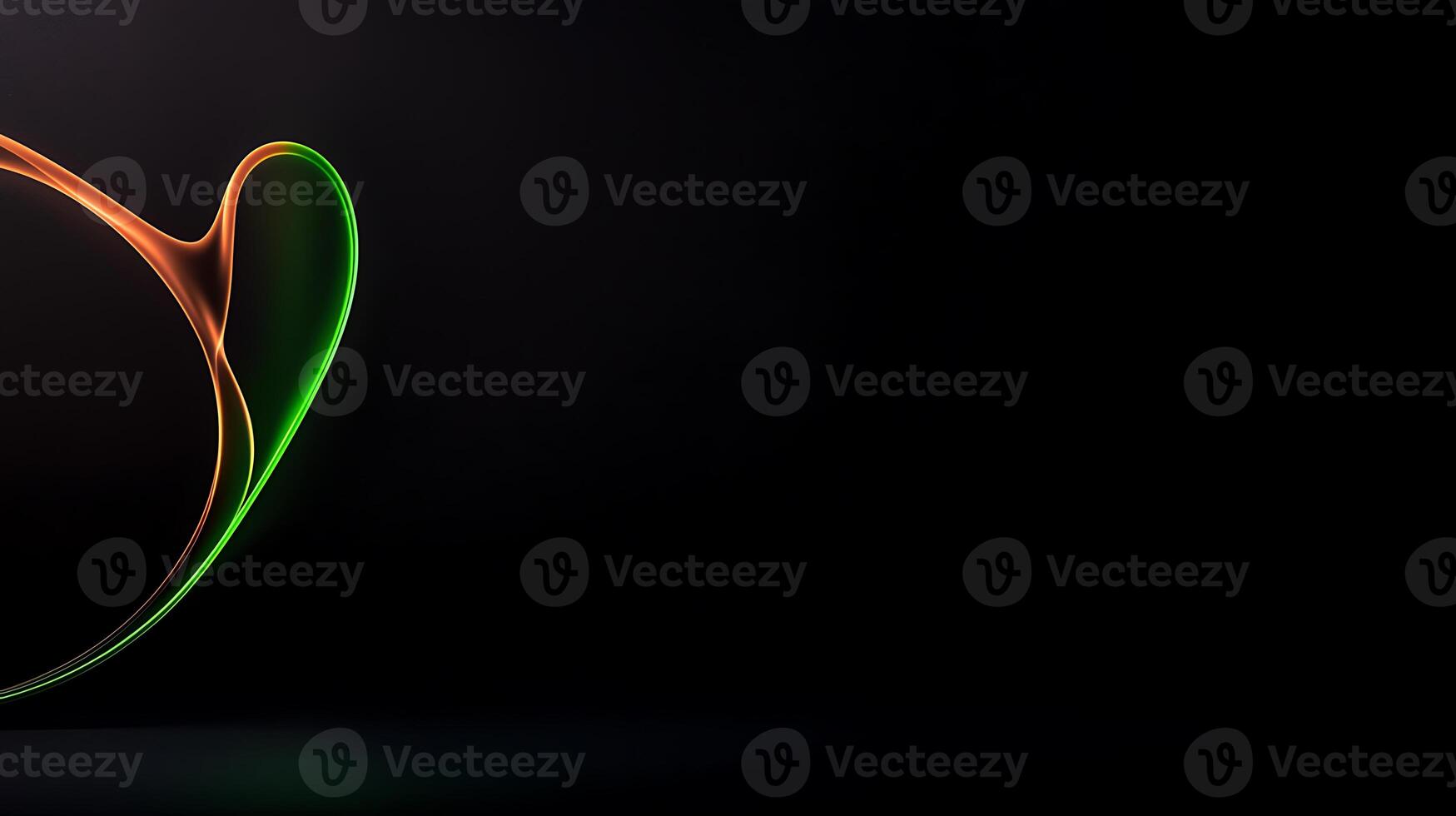 A green and orange light is shining on a black background photo