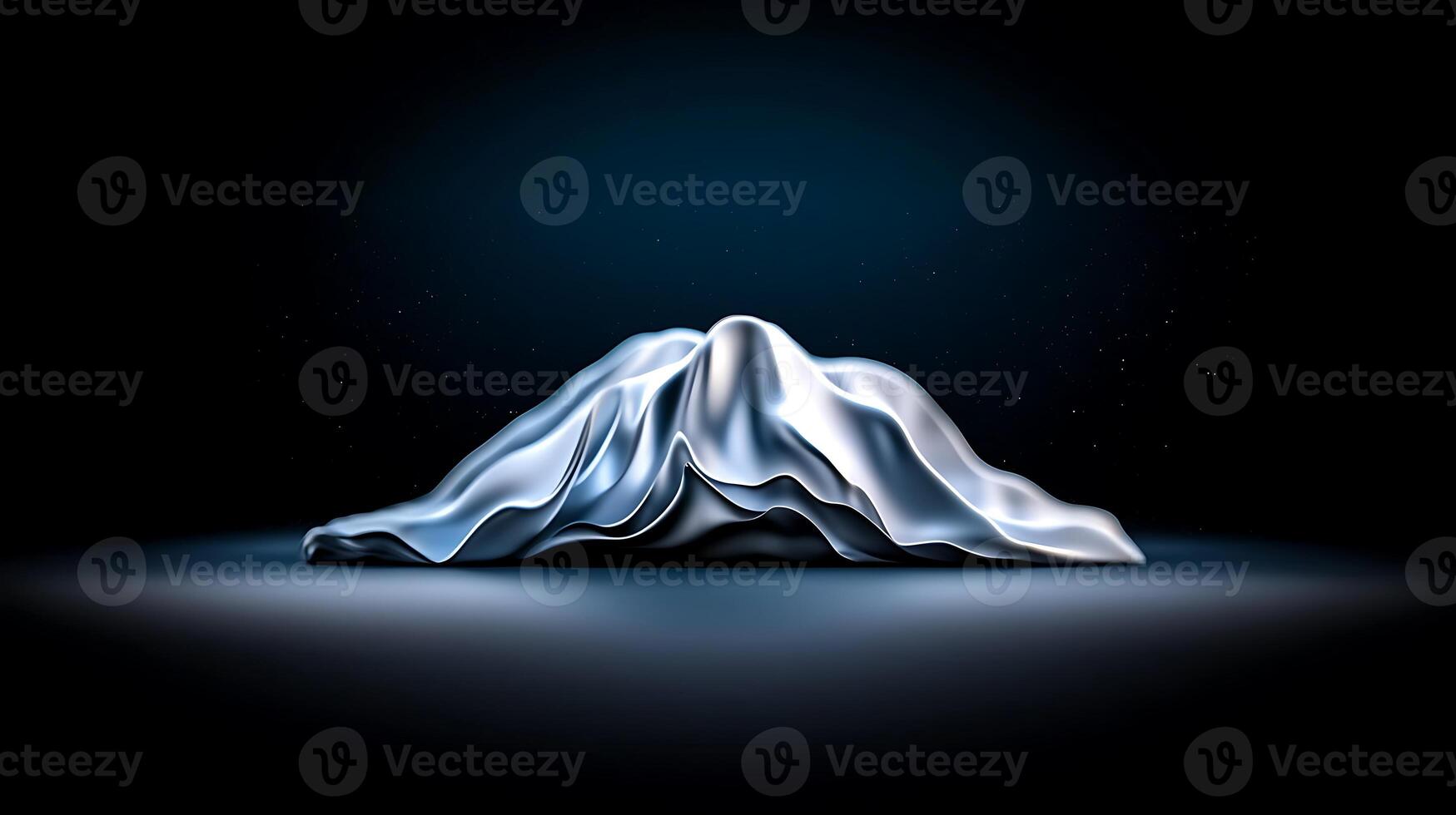 A mountain in the dark with a light shining on it photo