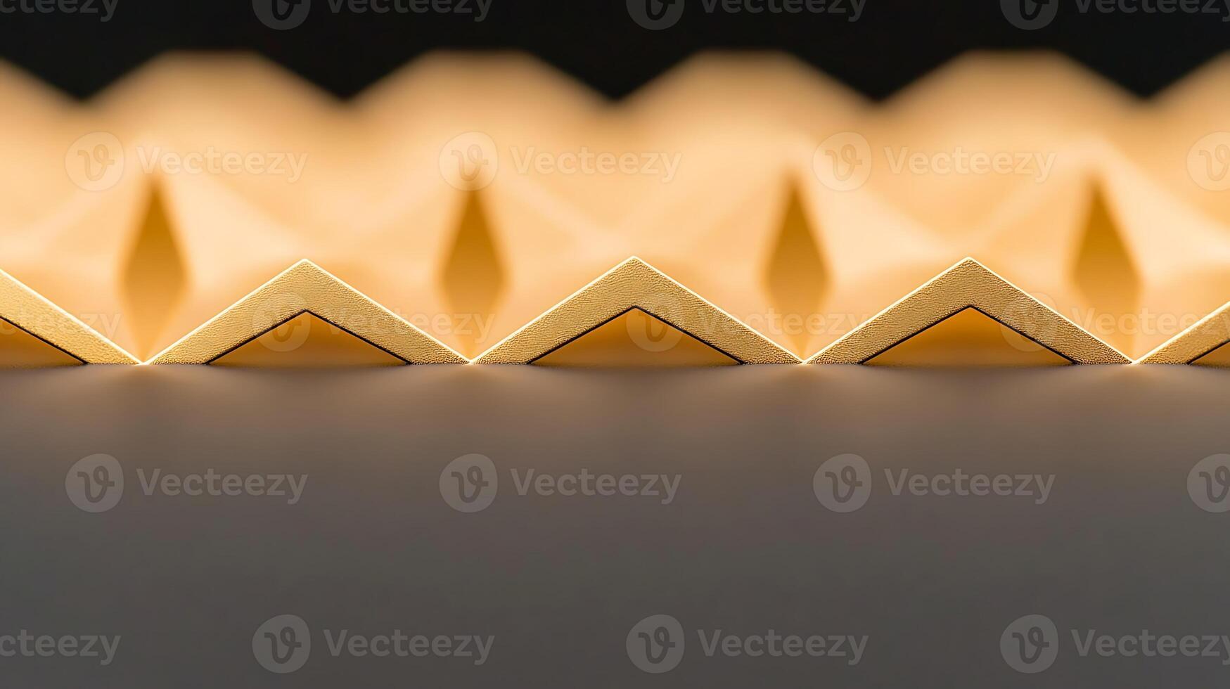 A close up of a golden pyramid with triangles photo