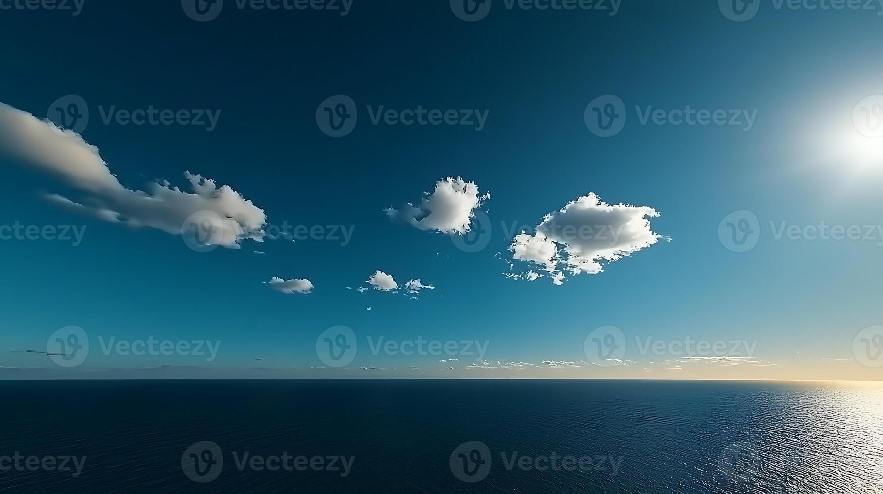 A beautiful blue sky with clouds over the ocean photo